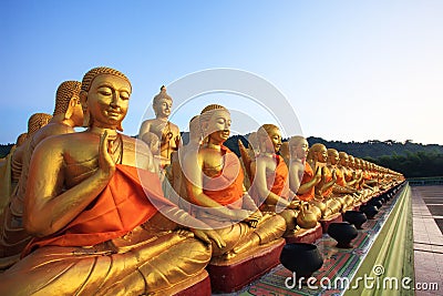 Golden buddha statue in buddhism temple thailand against fade b Stock Photo