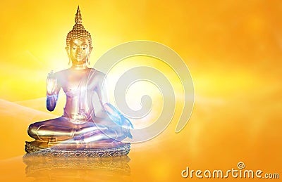 Golden Buddha statue with glittering aura on a golden yellow background for design and a beautiful background. Stock Photo