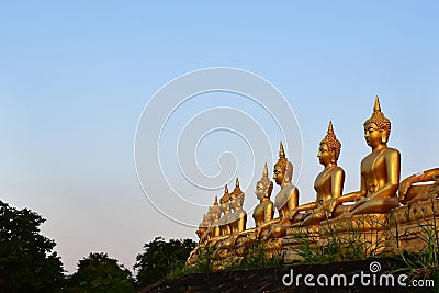 The golden Buddha statue of Phu Salao temple in beautiful sunset moment at Pakse Stock Photo