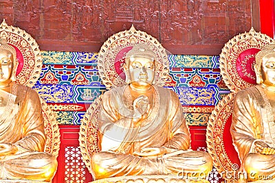 Golden Buddha statues of a Chinese temple Stock Photo
