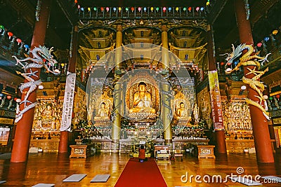 Golden Buddha Statues inside Yakcheonsa Temple. Jeju, South Korea Editorial Stock Photo