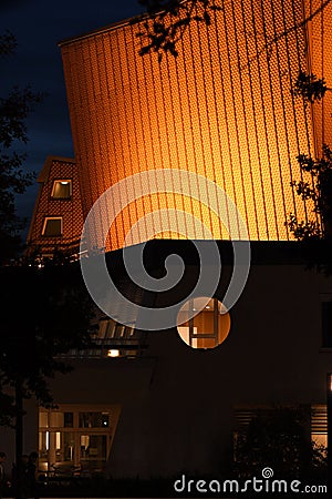 Golden building of the Berlin Philharmonic Hall at night Editorial Stock Photo