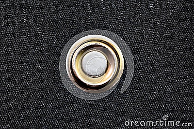 Golden Button On Black Textile Stock Photo