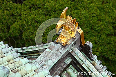 Golden carp statue on the roof of the Osaka Castle Stock Photo