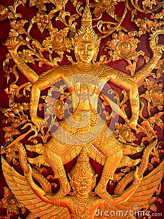 Golden Carved Wood, Indra Stepped on Garuda Stock Photo