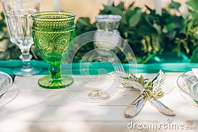 Golden celtic wedding rings on white wooden table Stock Photo