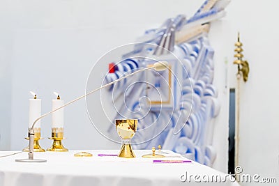 The golden chalice on the altar during mass Stock Photo