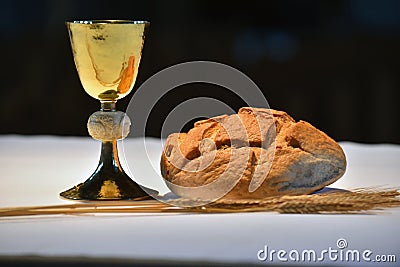 Golden chalice, bread. Stock Photo