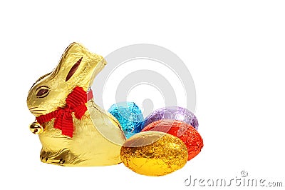 Golden chocolate Easter bunny with eggs Stock Photo