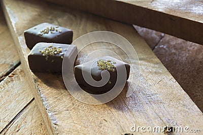 Golden chocolates Stock Photo