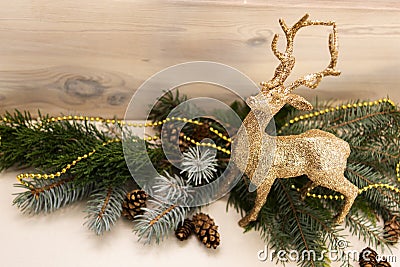 Golden, Christmas reindeer in brocade. Christmas decoration. Stock Photo