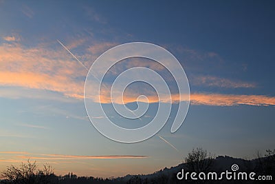 Golden clouds sky over the hill Stock Photo