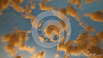 Golden clouds on the blue starry sky in the morning or evening Stock Photo