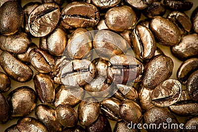 Golden coffee beans. background. texture Stock Photo