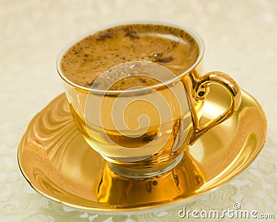 Golden coffee cup Stock Photo