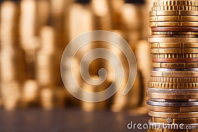 Golden coin stacks, rich money background Stock Photo