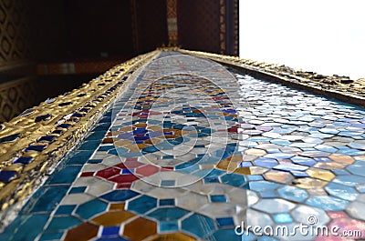 Golden colorfull mosaik glass Bangkok temple Thailand buddhism Stock Photo