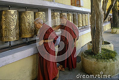 Golden coloured Buddhist prayer wheel at Namgyal Monastery, Dharamsala, Himachal Pradesh, Editorial Stock Photo