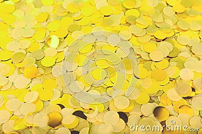 Golden confetti on the bold neon green background, holiday celebration backdrop Stock Photo