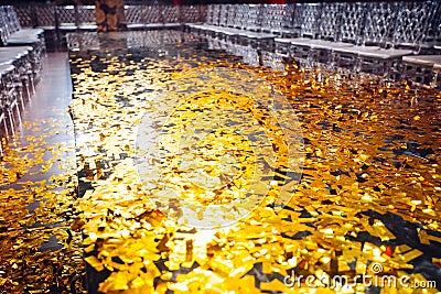 Golden confetti With Sparkling Glitter in fashion exhibition pod Stock Photo