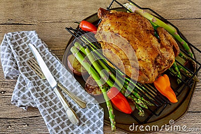 golden crispy skin chicken grilled in oven with potato wedges Stock Photo