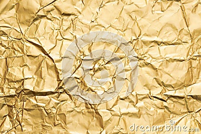 Golden crumpled foil paper texture abstract background Stock Photo