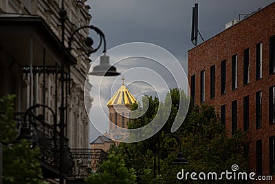 Golden Cupola Church in Cityscape Stock Photo