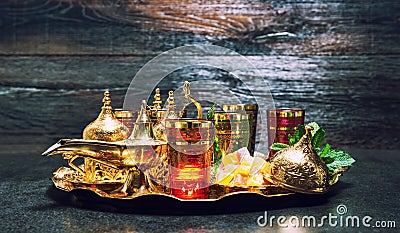 Golden decoration oriental lantern Tea glasses mint leaves vintage Stock Photo