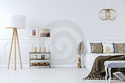 Golden decorations in luxurious bedroom Stock Photo