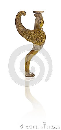 Golden decorative element in the form of an ancient mythological monster griffin isolated on white background. Design element with Stock Photo