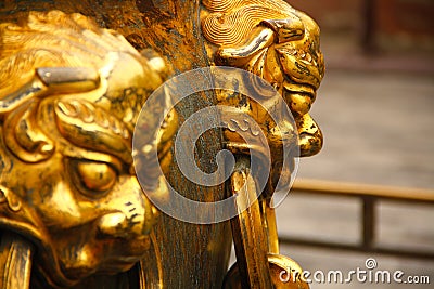 Golden demon heads Stock Photo