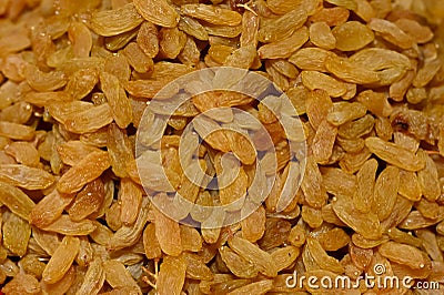 Golden Dried Seedless Grapes Top View. Raisins Background Stock Photo