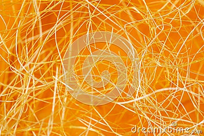 Golden dry straw texture, rolled decorative spiral, tangled curls of shavings. Option for Easter background Stock Photo