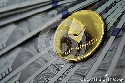 Golden Ether ETH on hundred dollars bills. Close-up, macro shot Editorial Stock Photo