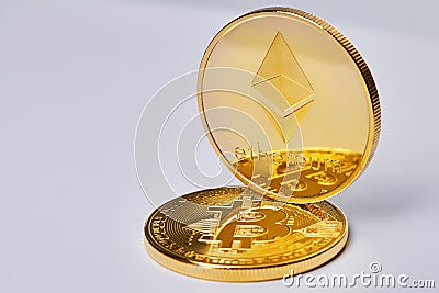 Golden ethereum coin. Crypto currency blockchain coin ethereum symbol on light background. Editorial Stock Photo