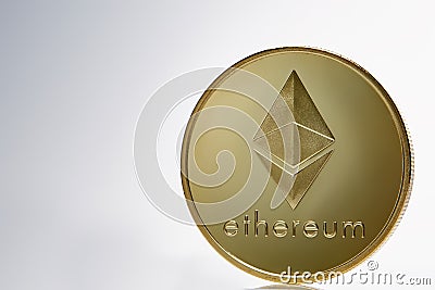 Golden ethereum coin. Crypto currency blockchain coin ethereum symbol on light background. Editorial Stock Photo