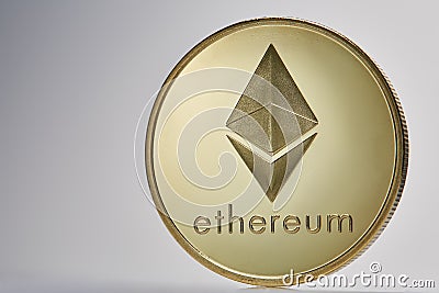 Golden ethereum coin. Crypto currency blockchain coin ethereum symbol on light background. Editorial Stock Photo
