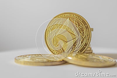 Golden Etherium coin close up on white background. Editorial Stock Photo