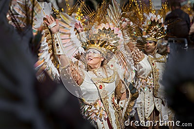 Golden fantasy costumes in carnival parade Editorial Stock Photo