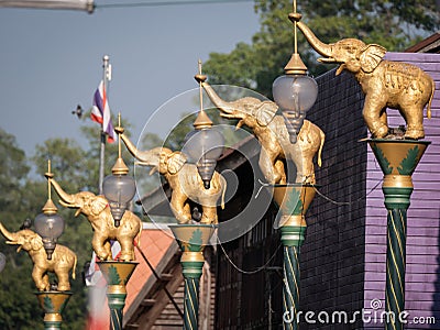 Golden Fighting Elephants Statue on Top of The Pillar in The Purple Town Stock Photo