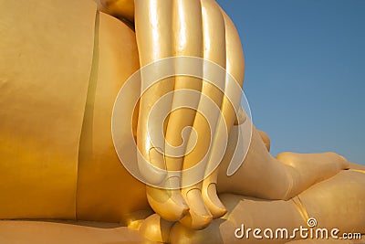 Golden finger of big buddha statue Stock Photo