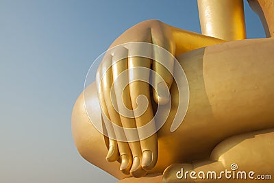 Golden finger of big buddha statue Stock Photo