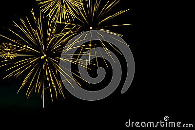 Golden fireworks border on the black sky background with copyspace Stock Photo