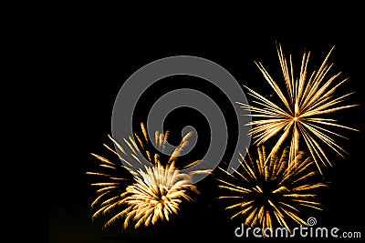 Golden fireworks border on the black sky background Stock Photo