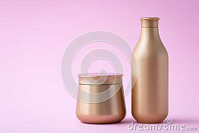 Golden flacon of shampoo and a jar of mask. Cosmetic products on a pink background. Luxury beauty style, hair care concept. Clear Stock Photo