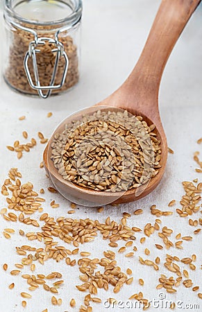 Golden flax seeds. Micronutrient beneficial for the organism that prevents and cures ailments. Rich in fiber and nutrients Stock Photo