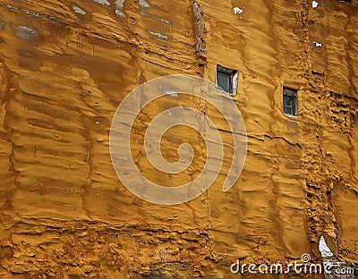 Golden foam protection in party wall with two windows, polyurethane foam Stock Photo