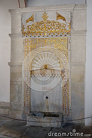 The Golden Fountain. The golden fountain Mag-tooth is made of marble and is located in a fountain courtyard near the entrance to Stock Photo