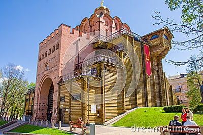 Golden Gate - ancient fortification building monument from times of Kievan Rus in side view of spring photo in frame of green gras Editorial Stock Photo