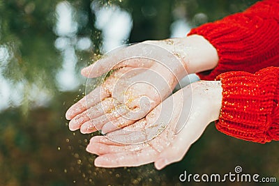 Golden glitter on hands Stock Photo